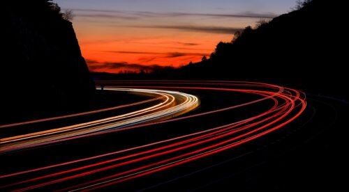 tail light streaks on highway at night. Long exposure.